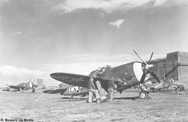 Early model P-47D's on a British airfield