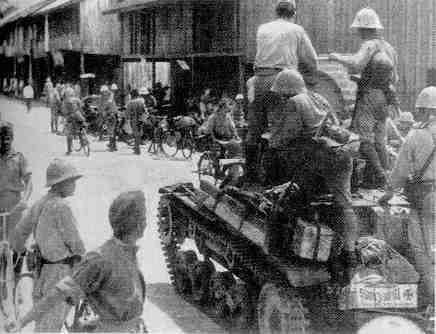 Japanese tanks with infantry entering Batavia, March 1942